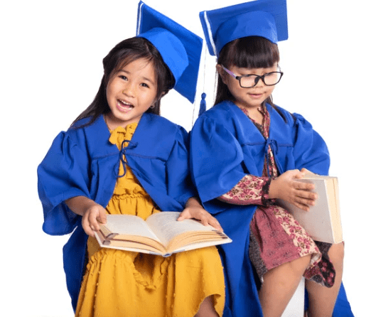 Young bilingual girl wearing a graduation cap and holding a diploma